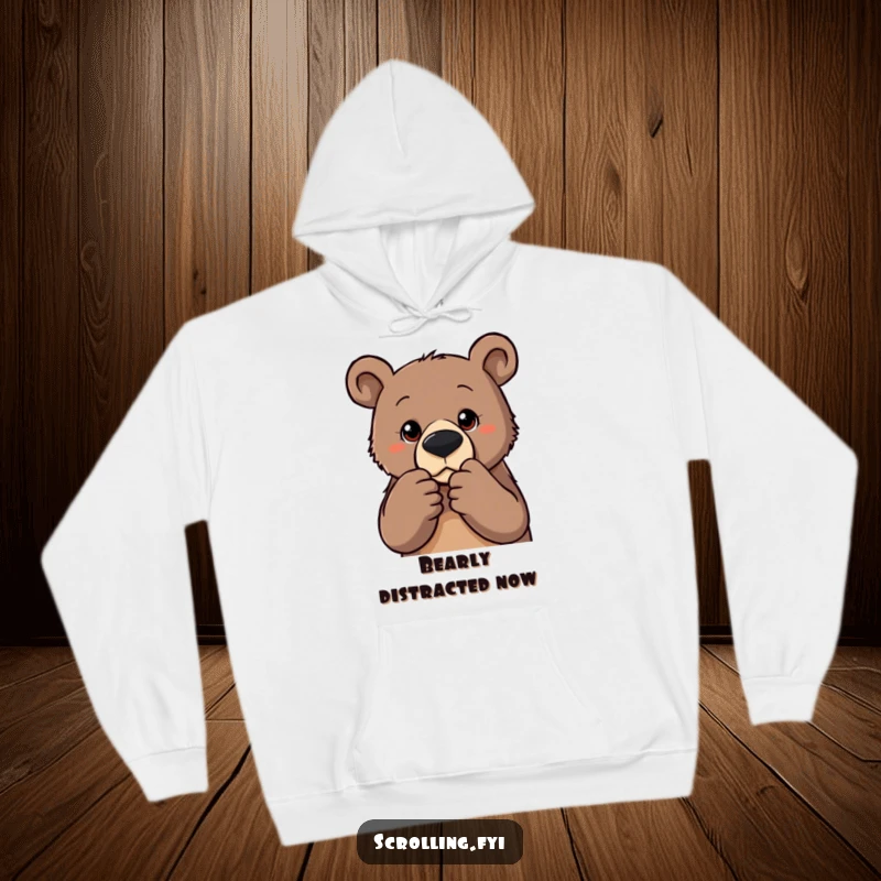 Funny hoodie with a determined bear intensely zooming on a photo, offering warmth and a humorous design for the focused individual.