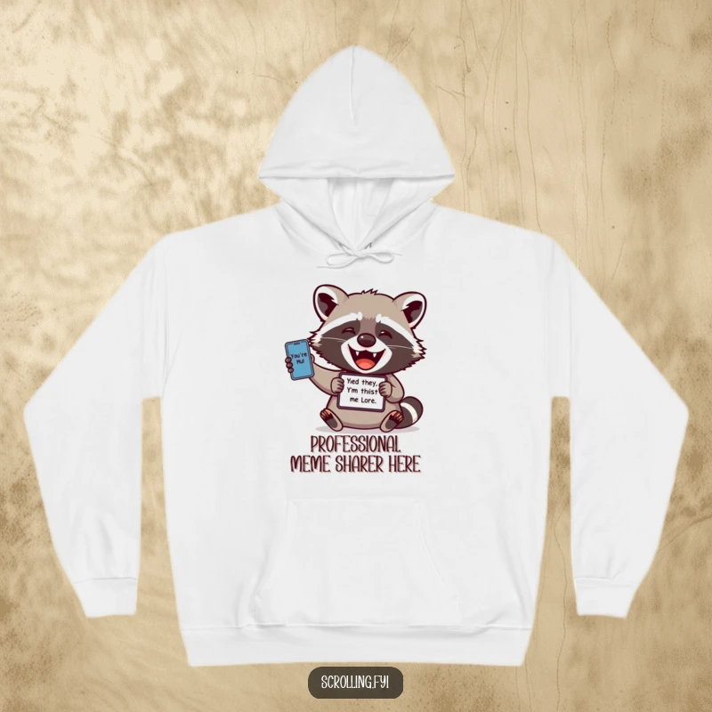 Funny hoodie: A delightful raccoon is joyfully sharing a funny meme from its handheld device, embodying tech-savvy amusement.